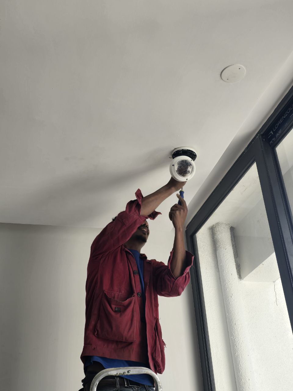 Tek technician installing a dome CCTV camera